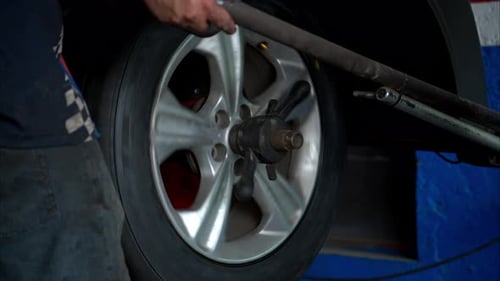 Car Tire Balancing in a Repair Shop
