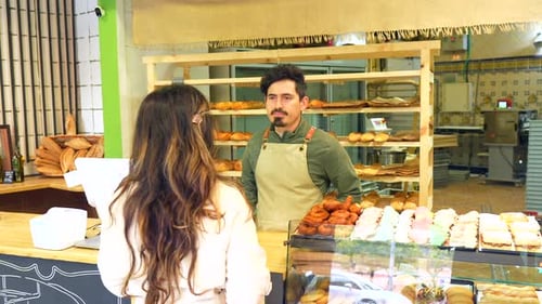 A Woman Buying in an Artisan Bakery