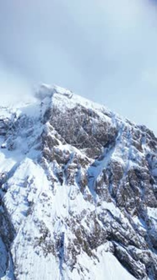 Fronalpstock Schwyzer Alps Swiss alpine winter, snow covered aerial drone