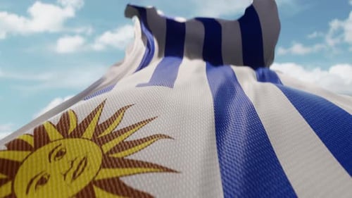 Realistic Uruguay Flag Waving with Clouds and Sky