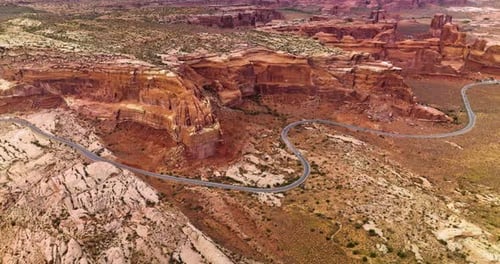 Huge rocks of canyons in Utah, USA. Motorway going round the terrific mountains through the desert.