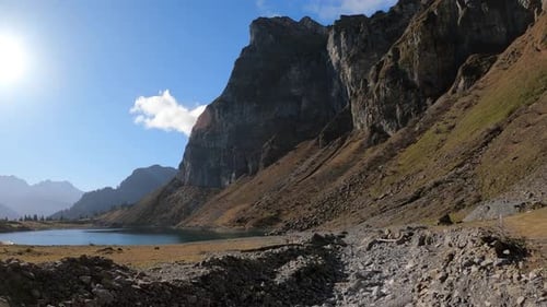 low proximity flight in to a rocky riverbed. Ending with e beautiful view of the mountain lake and t