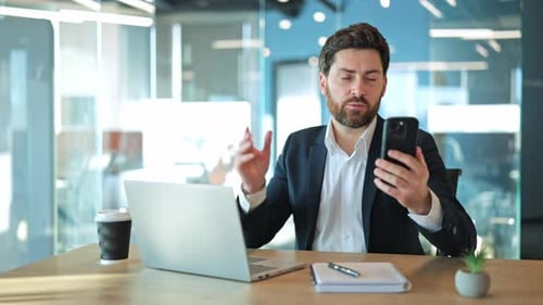 Professional Businessman Communicating on Video Call in Modern Office