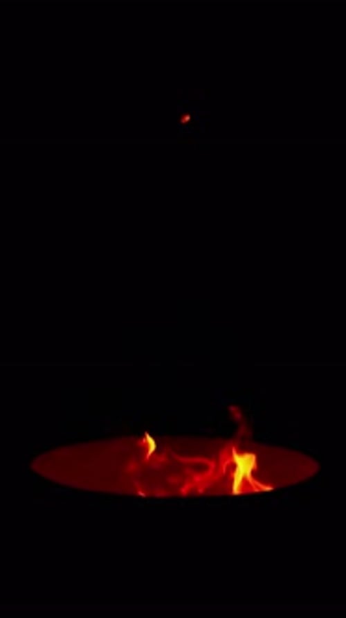 Cinematic Medium Shot of Bonfire with Glowing Embers and Flames at Night