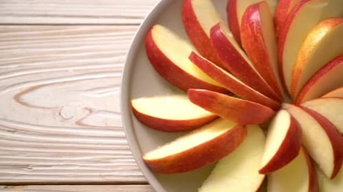 fresh red apple slice on plate