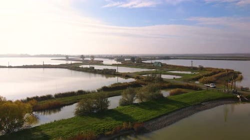 Aerial View of 300 hectare Fish Farm with Water Channels and Scenic Landscape