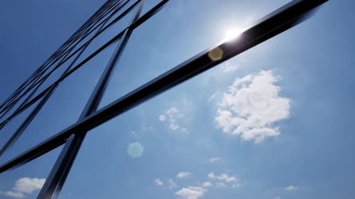 Modern Glass Building Interior with Transparent Walls and Windows Creating Bright Reflections in