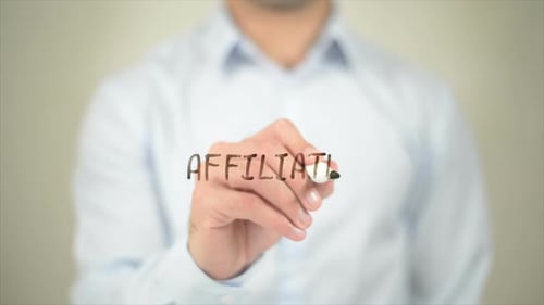 Man Writes Affiliate on Clear Surface
