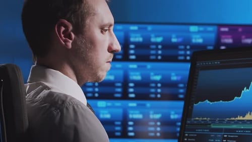 Trader Works in Office Using Workstation and Analysis Technology Workplace of Professional Crypto