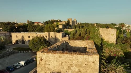 Rhodes old town houses and surrounding fortifications at sunrise, Greece