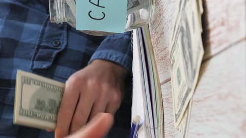 Man Saving Money for Car and Taxes