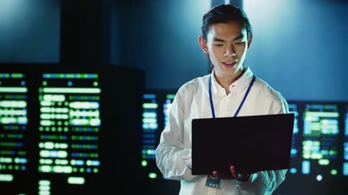 Employee Strolling Through Data Center