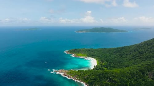 Aerial View of Tropical Islands with Turquoise Waters and Lush Coastline La Digue Seychelles