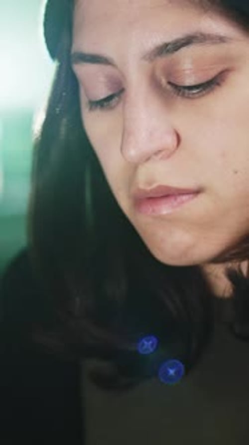 Young Adult Looking at Technology Close Up