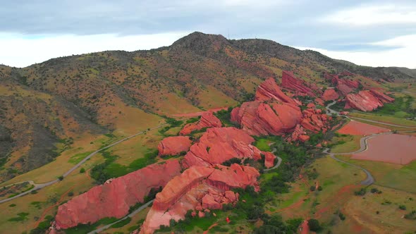 Aerial panning shot of Red Rocks, outdoors live venue outside Denver ...