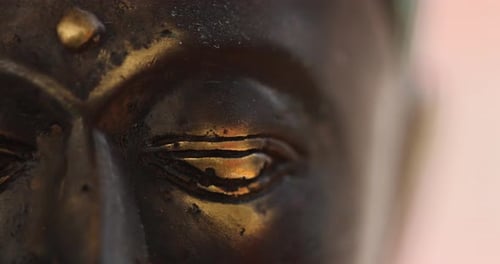 Buddha statue close up. Spirituality, meditation and third eye opening concept. 4k resolution