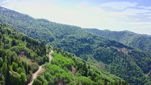 Flying Above Mountain Pass On Sunny Summer Day