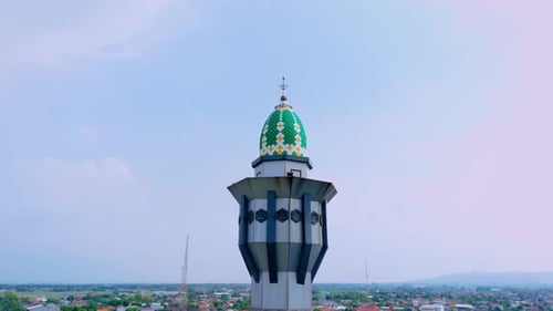 Aerial view of islamic mosque tower with landscape of local house building