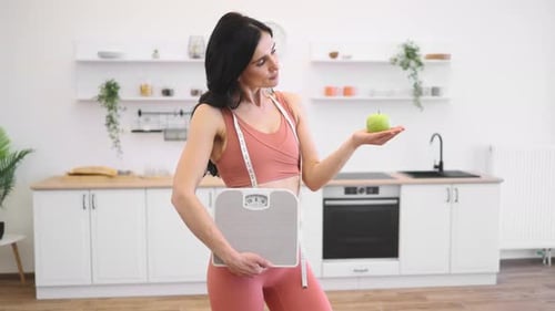 Woman with Apple, Scale, and Measuring Tape