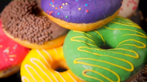 Colorful Donuts Rotating in Close-Up Shot