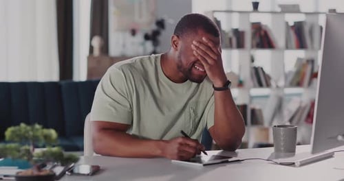 A Focused and Dedicated Professional at Work in a Stylish Modern Office Space Environment