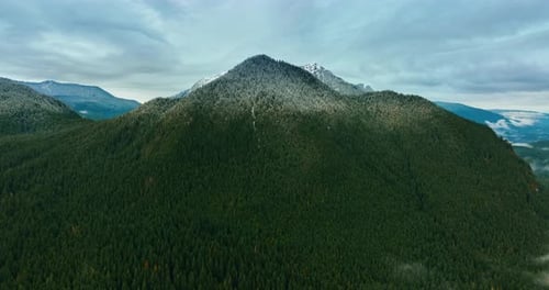 Approaching the spectacular mount covered with green pine tree forest