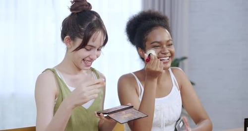 Women Applying Makeup Together at Home