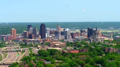 Downtown minneapolis Minnesota skyline panning aerial view over the city in summer