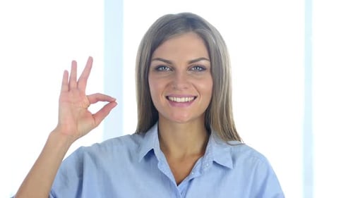 Fair-Haired Woman Giving 'OK' Gesture