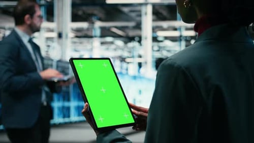 Isolated Screen Mockup Tablet Writing Code and Developer in Data Center