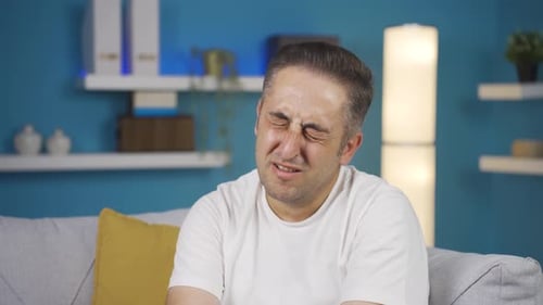 Sad man is crying.