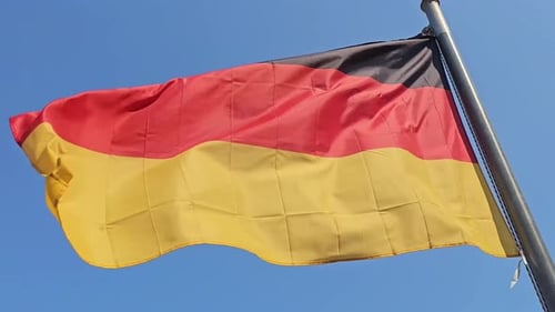 German Flag Waving in the Wind on Sunny Day