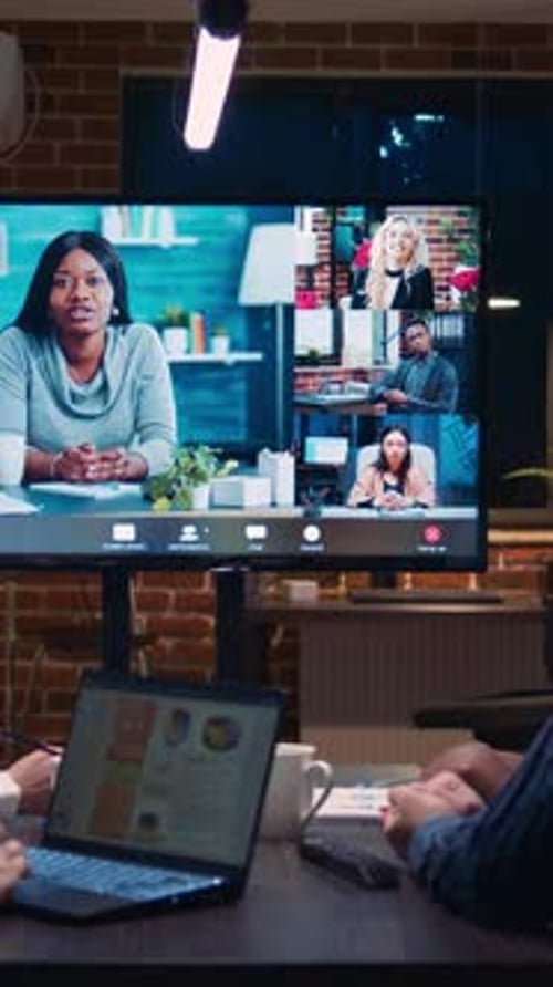 Team Meeting via Video Conference in Office
