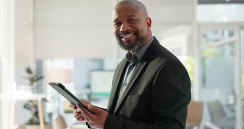 Portrait of happy black man in office with tablet, email or social media for business