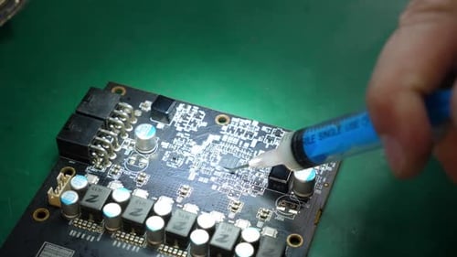 Applying Substance to a Circuit Board Close Up