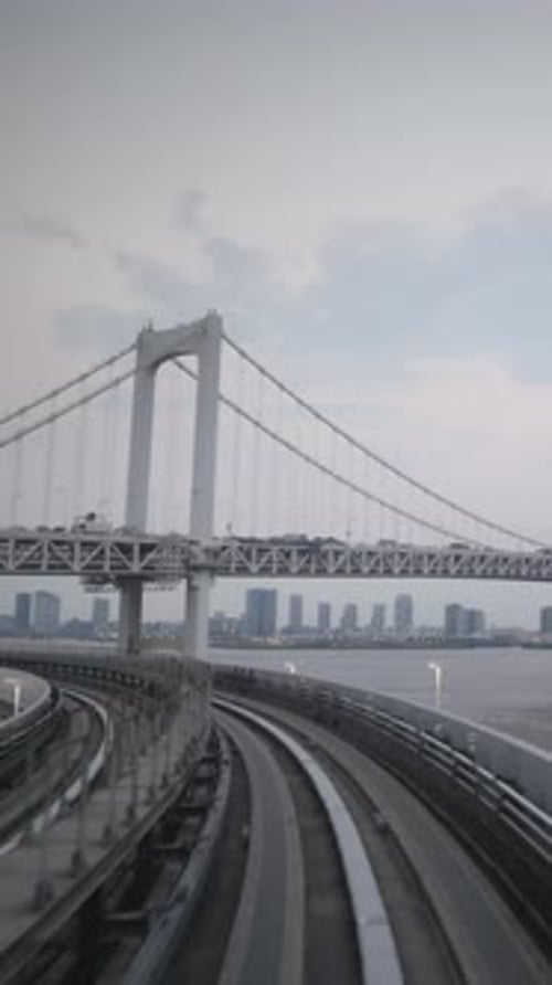 Tokyo Monorail Passing Through the City's Skyscapers in Vertical
