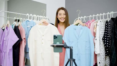 Woman Fashion Vlogging Selling Clothes in Studio