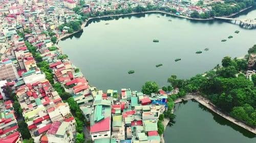 Drone, city and buildings on street, lake and transportation with infrastructure