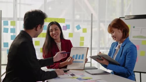 Team Collaborate on Business Strategy in Modern Office