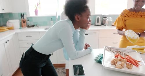 Women Preparing Meal Together in Kitchen at Home