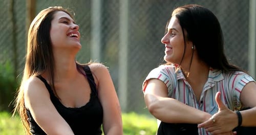 Friend real life laugh and smile outside park. Women laughing together