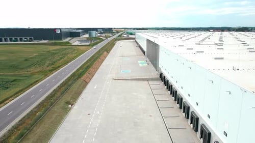 Logistics Warehouse Exterior with Loading Platforms Aerial View