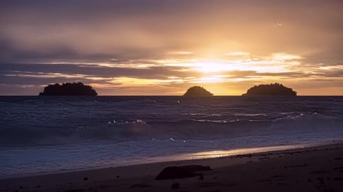 Sunset Waves Crashing on Tropical Beach