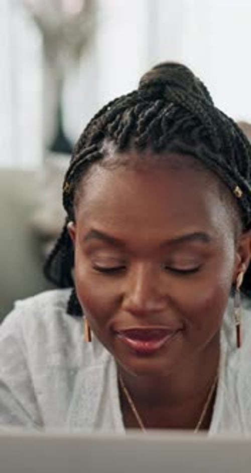 Black woman, laptop or social media to relax on couch typing on blog, website or email on internet