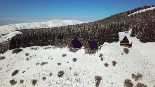 Aerial view of chalet cottages in mountain resort