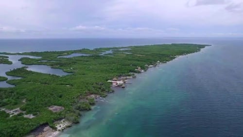 Tintipan coral island in Colombia at calm day. Aerial drone view