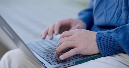 Programmer Writing Code on Laptop Keyboard Montage