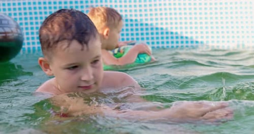 Children Play in Swimming Pool on Sunny Summer Day Pool Fun