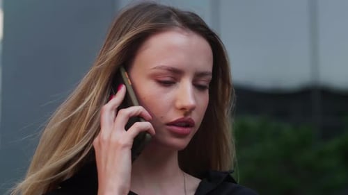 Woman Talking on Cell Phone Outdoors