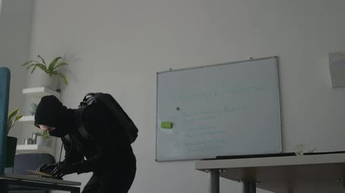 Masked Man Breaking into Office Stealing Folder with Secret Corporate Data